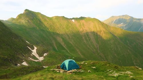 Tent in Green Mountain Landscape