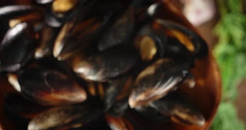 Close Up of Fresh Mussels in Wooden Bowl