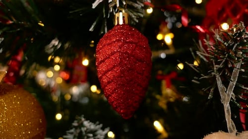 Red Ornament Close Up on Christmas Tree