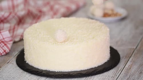 Decorating White Coconut Cake with Coconut Balls