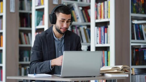 Student Talking at Computer in Library