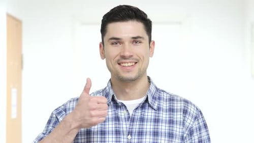 Smiling Man Giving Thumbs Up Gesture