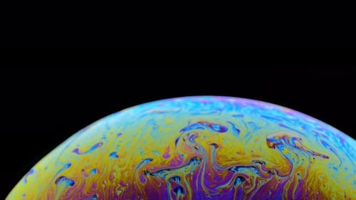 Close Up of Colorful Iridescent Soap Bubble