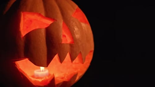 Dark Night a Lantern in the Shape of a Pumpkin on Halloween.