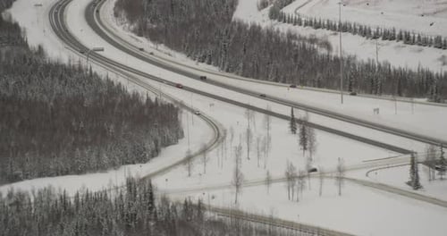Helicopter aerial moving steadily over green hills, day