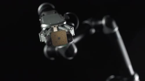 Robotic Arm Holding Computer Processor Chip