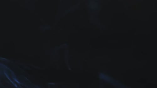 Abstract Blue Smoke Rising on Black Background