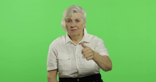 An Elderly Woman Show Thumb Up and Smiles. Old Grandmother. Chroma Key