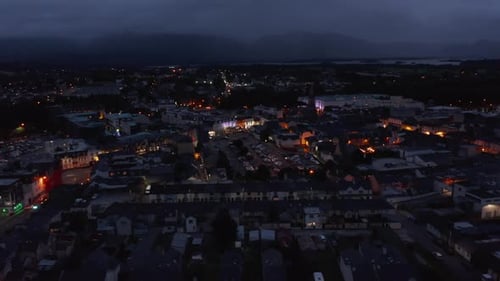 Slide and Pan Shot of Colourful Buildings in Evening Town