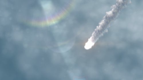 Dynamic Meteor Falling Through Cloudy Sky