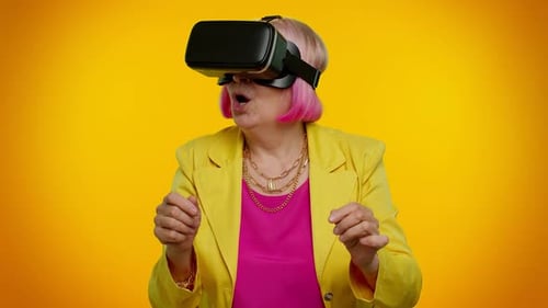 Senior Adult Enjoying Virtual Reality Experience with VR Headset