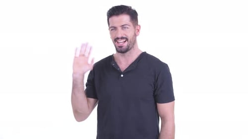 Happy Young Handsome Bearded Man Waving Hands