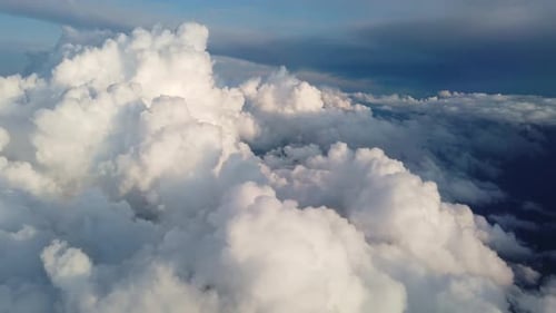 Aerial View of Fluffy White Clouds and Blue Sky
