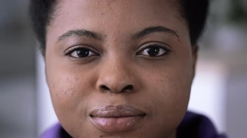 Young Person Smiling Closely At Camera