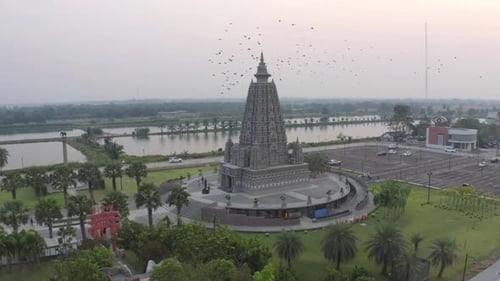 Aerial view of Wat Panyanantaram at sunset, a Buddhist temple in Pathum Thani City, Thailand.