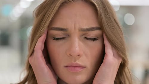 Close Up of Face of Woman Having Headache