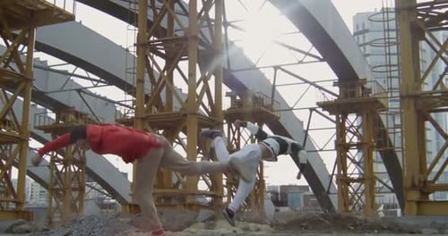 Young Adults Practicing Parkour on Construction Site