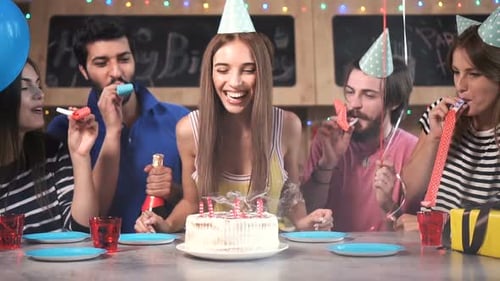 Friends Celebrate a Birthday Party with Cake