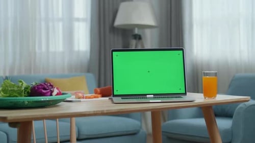 Green Screen Laptop On The Table With Healthy Food