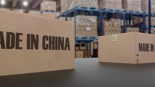 Boxes with MADE IN CHINA Text on Conveyor