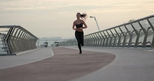 Fit Sportswoman Running on Path