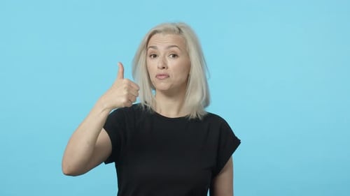 Woman Giving Double Thumbs Up and Winking