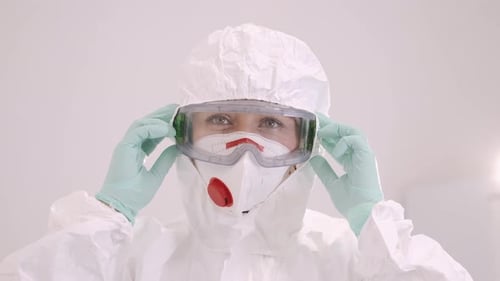 Person in Hazmat Suit Wearing Protective Gear