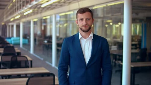 Businessman Shows Thumb Up in Office