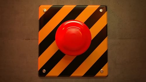 Close up of a big red vintage button during a dangerous emergency situation.