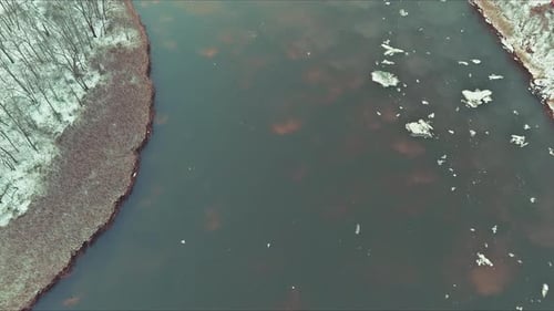 Ice Drift on the River in Early Spring of Ice Float Down the Stream