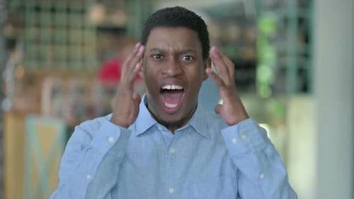 Man Shouting in Frustration