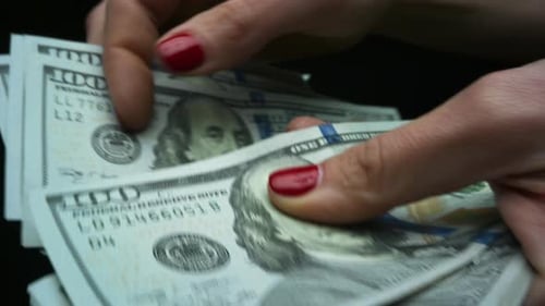 Woman Checking Amount of Cash Money. Hands Holding One Hundred Dollar Bills