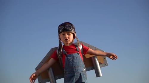 Child in Homemade Airplane Costume Pretends to Fly
