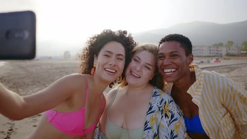 young women having fun on the beach