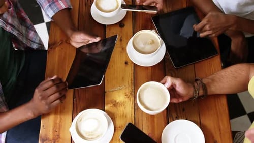 Group Uses Technology Over Coffee, Birds Eye View