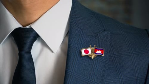 Close Up of Flags Japan and Cambodia on Suit