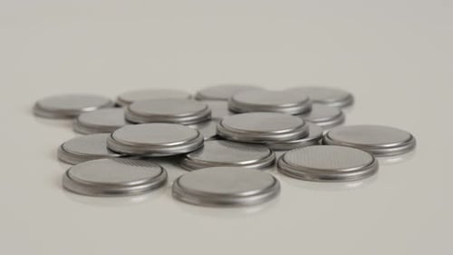 Pile of Silver Button Batteries Close Up