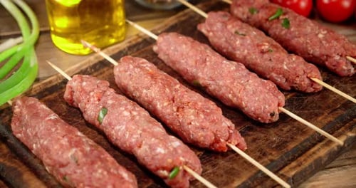 Raw Sausages on a Stick of Homemade Mince Rotate.