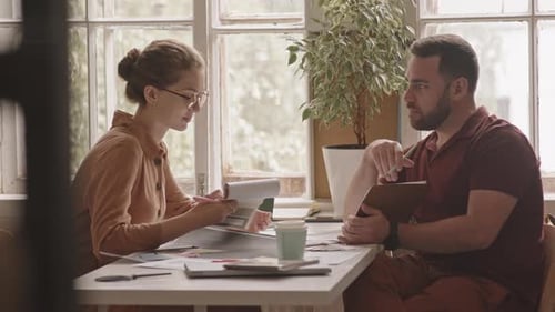 Female Designer Talking to Client in Agency