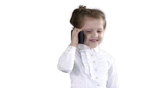 Smiling Girl Talking on Cellphone Against White Background