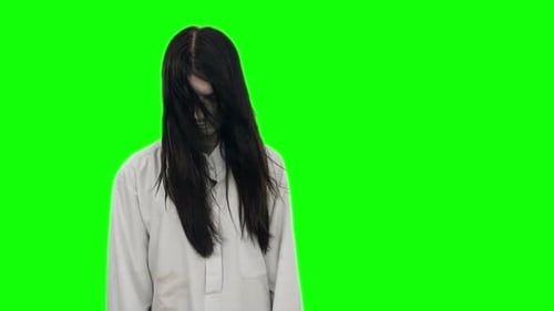 Ghost Girl with Long Black Hair and Wearing a White Shirt at the Chroma Key.