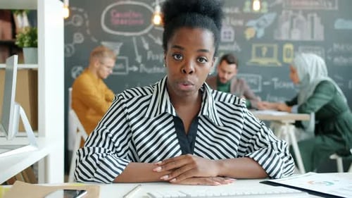 Portrait of Ambitious AfroAmerican Businesswoman Making Online Video Call From Office