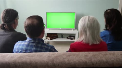 Family Watching TV. Green Screen.