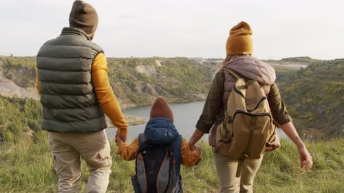 Family Hike Overlooking Picturesque Lakeside Scenery