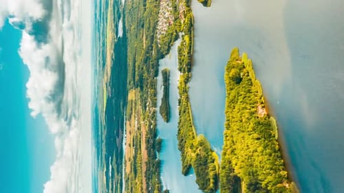 Aerial View of Serene Lake Surrounded by Green Forest
