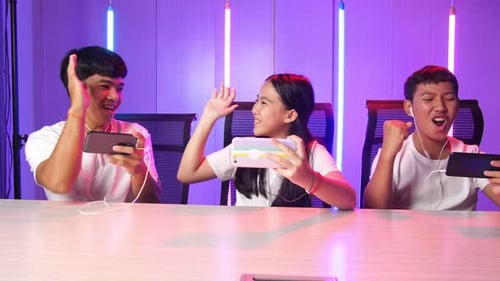 Teen Friends Playing Mobile Games Together