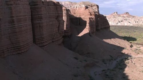 Flying backwards from desert canyon to view the landscape