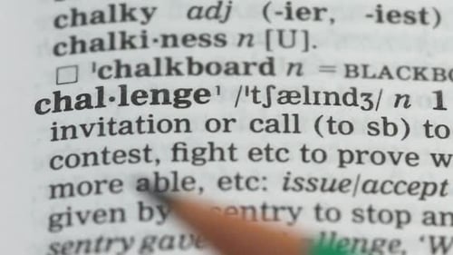Dictionary Definition of Challenge with Pencil Underlining
