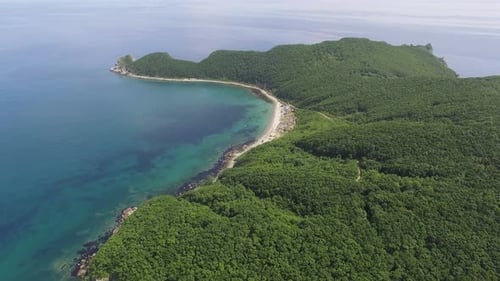 Drone View Above the Sea Along the Rocky Coast on a Sunny Day