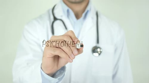 Doctor Writes Psychotherapy on Clear Surface Close Up